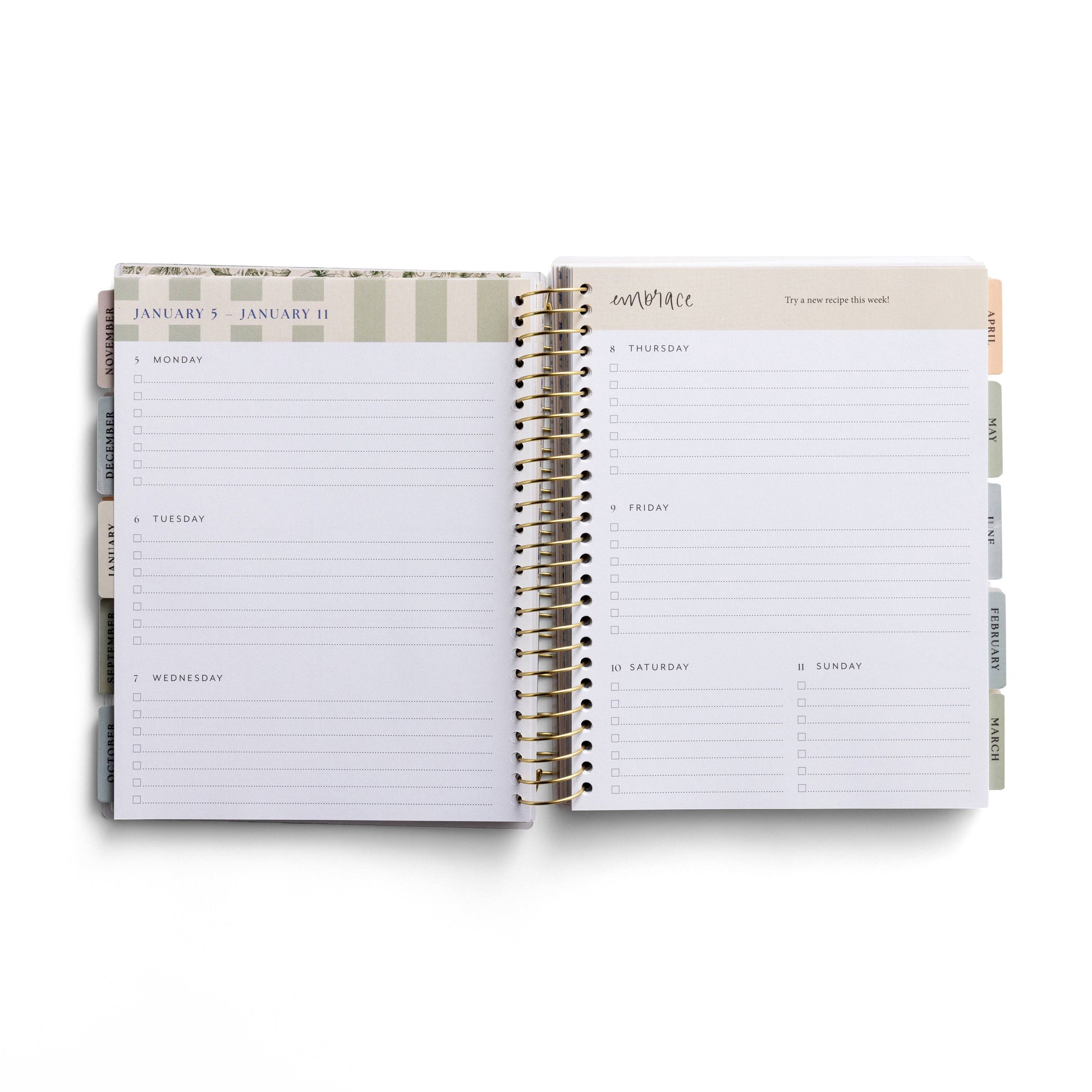 Open planner showing a weekly layout with days of the week on a white background