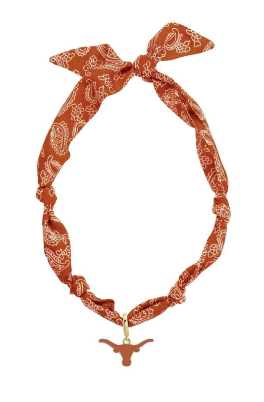 Orange bandana headband with a longhorn charm on a white background