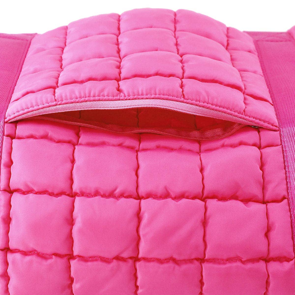 Close-up of a pink quilted jacket with a white background
