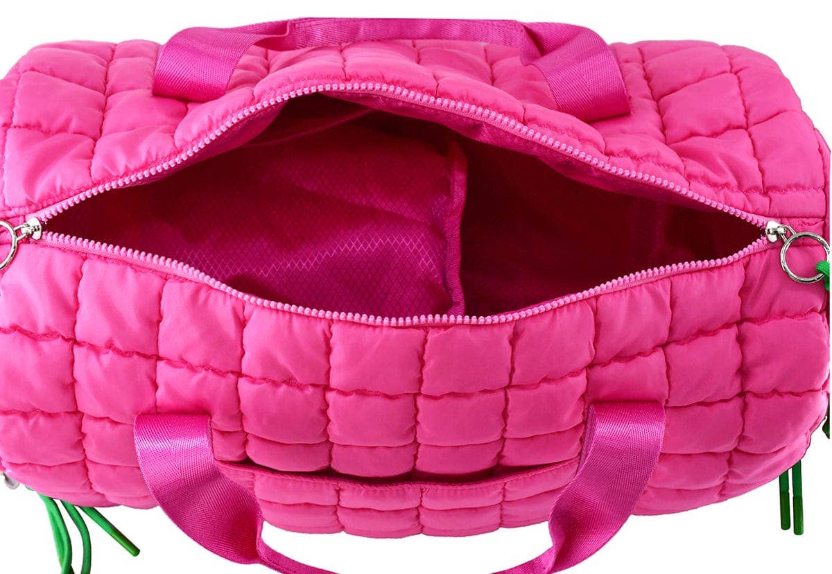 Pink quilted bag with a visible zipper on a white background
