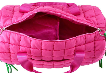 Pink quilted bag with a visible zipper on a white background