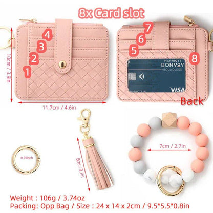 Pink wallet with card slots, keychain, and bracelet on a white background