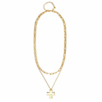A gold-toned double-strand necklace featuring a chunky paperclip chain and a delicate chain with a cross pendant, displayed on a clean white background.