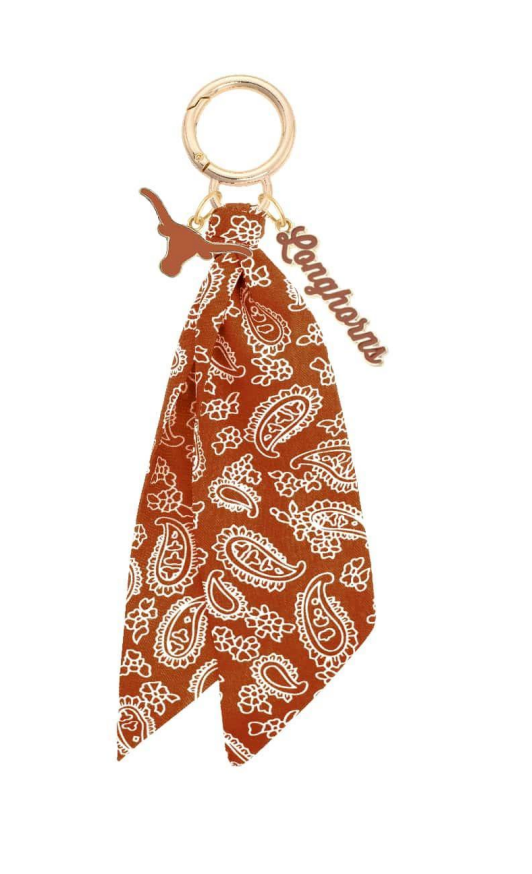 Orange bandana keychain with paisley pattern on a white background