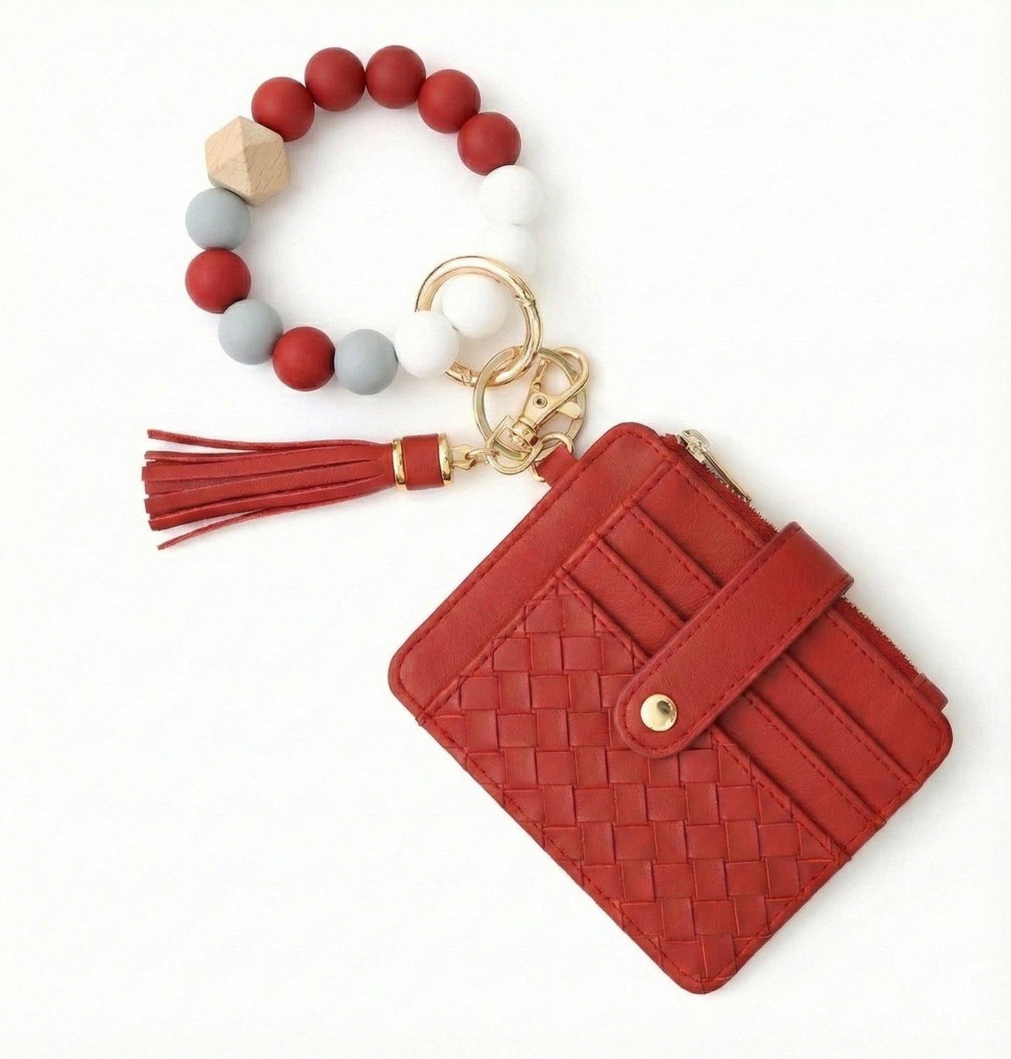 Red woven wallet with keychain and bracelet on a white background