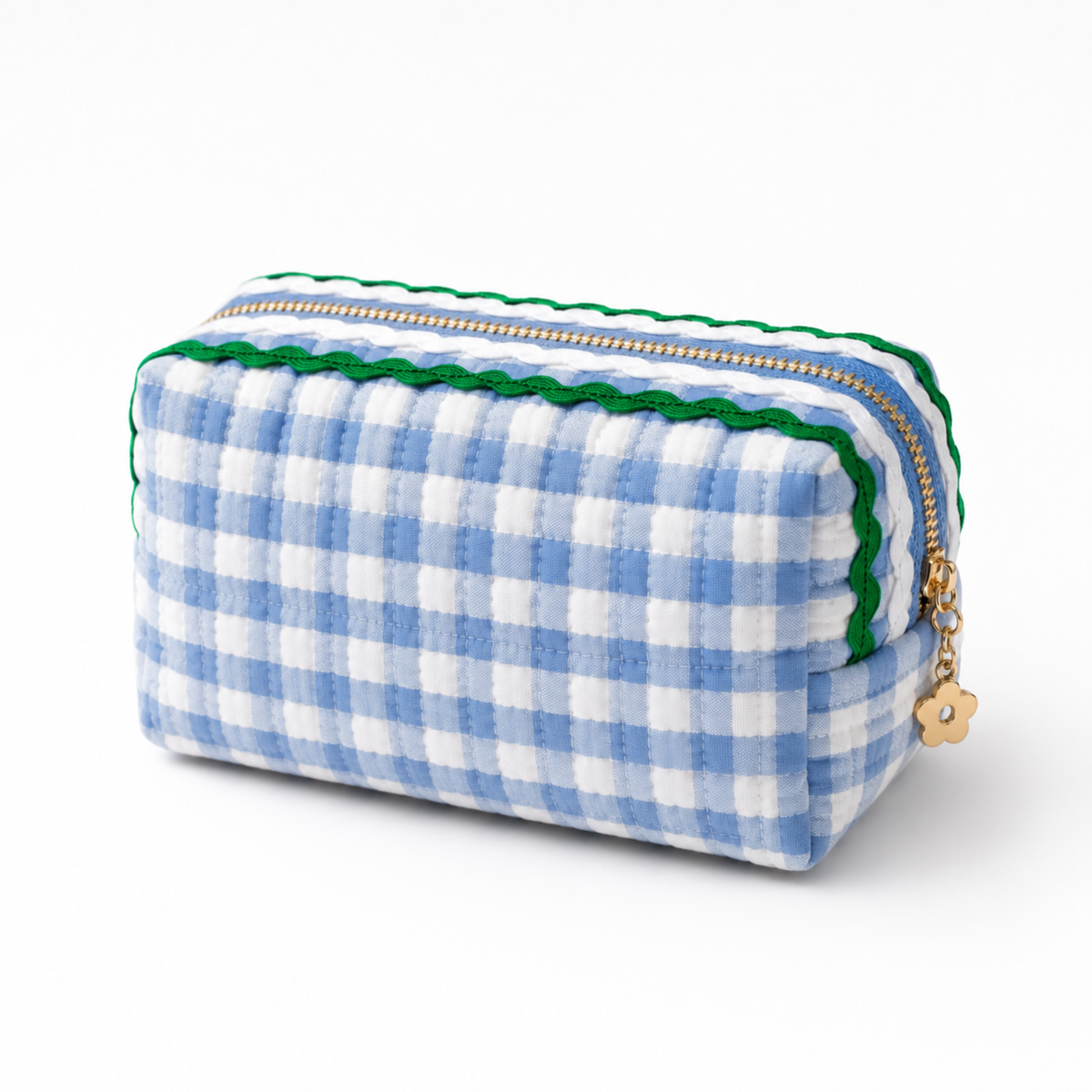 A small rectangular zip pouch with a blue and white gingham pattern, featuring a green scalloped trim along the zipper and a small gold flower charm.